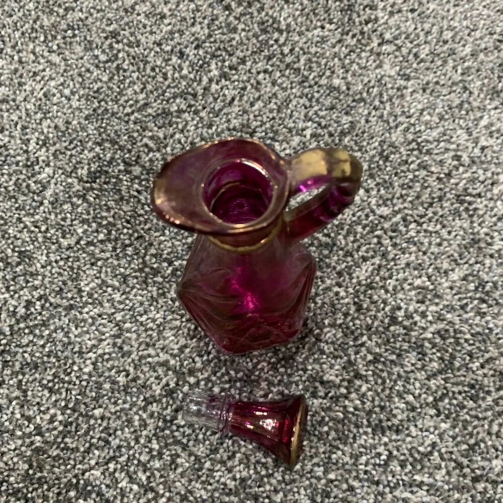 Glass pink and gold cruet